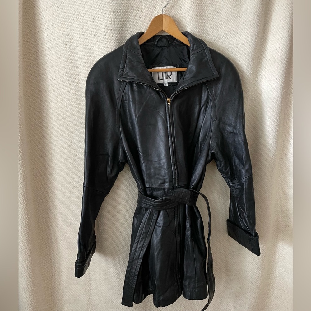 Black long 100% leather jacket. Lined. LNR. Zip pockets, belted. Classic!!
